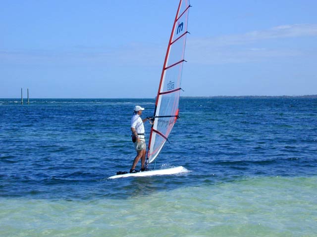 Mark goes windsurfing.