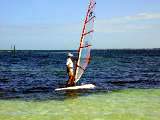 Mark goes windsurfing.